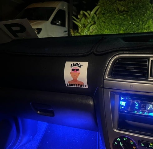 this is a picture of a customer who stuck this car sticker on their dash