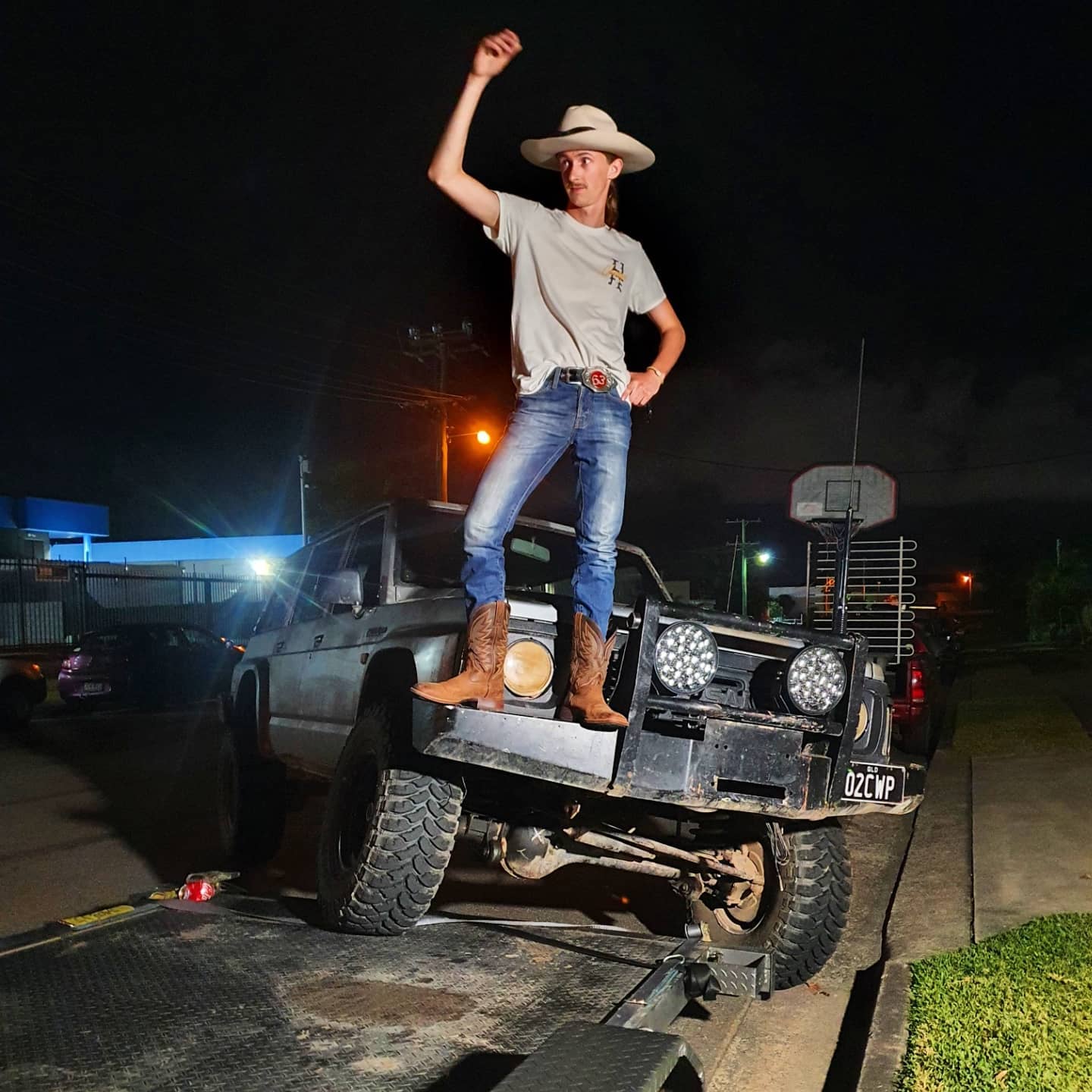 James Longstaff standing on a 4x4. The Aussie Country Bogan.